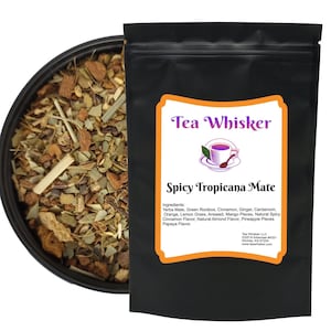 May include: A black pouch of "Spicy Tropicana Mate" tea from Tea Whisker, with a bowl of loose tea to the left. The label includes a logo of a teacup and saucer, and lists ingredients like Yerba Mate, cinnamon, and ginger.