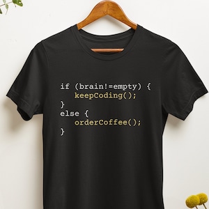 May include: Black t-shirt with a humorous coding-themed message: "if (brain!=empty) { keepCoding(); } else { orderCoffee(); }"