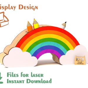 May include: Rainbow-shaped pencil holder made of wood with clouds on either side. The rainbow has red, orange, yellow, green, blue, indigo, and violet stripes. There are three pencils and a pen sticking out of the top of the rainbow. The text "wood toolbox" is on a small wooden box in the lower right corner of the image.