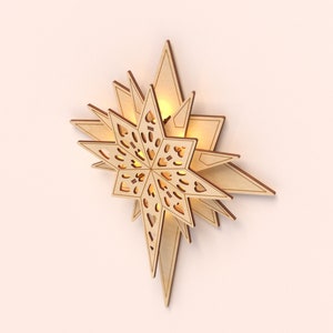 May include: A wooden star-shaped wall decor with a cut-out design and a warm glow emanating from the center.