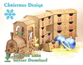 May include: Wooden Christmas advent calendar shaped like a train with 18 drawers. The train is decorated with a reindeer and Santa Claus. The drawers are numbered 1 through 18. The train is sitting on a white surface with blue and gold ribbon.