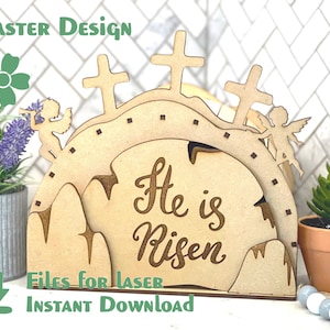 May include: Wooden Easter cross design featuring angels and the words "He is Risen" in a cut-out style. The design is ideal for laser cutting.