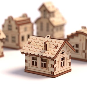 May include: A set of five wooden houses, each with a unique design and intricate details. The houses are made of light brown wood and have brown accents. The houses are all different sizes and shapes, and they are arranged in a row on a white background.