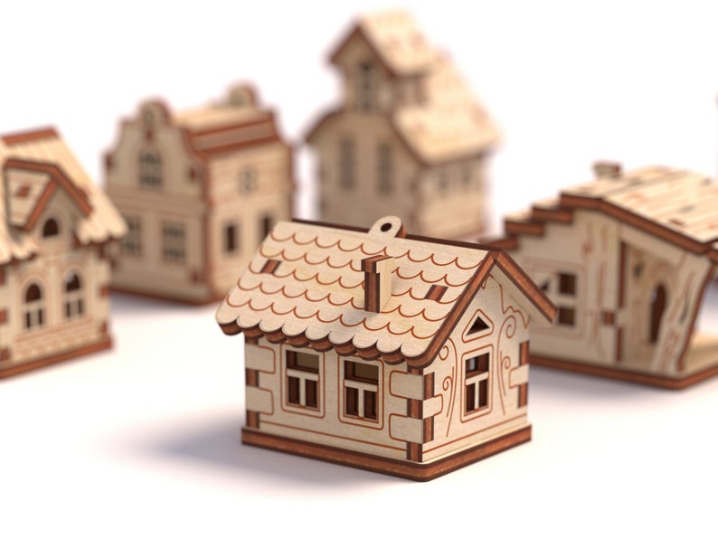 May include: A set of five wooden houses, each with a unique design and intricate details. The houses are made of light brown wood and have brown accents. The houses are all different sizes and shapes, and they are arranged in a row on a white background.