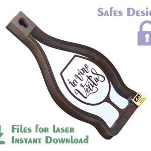 May include: A brown wooden wine bottle holder shaped like a wine glass with the text "in vino veritas" inside the glass. The holder has a keyhole at the top for hanging.