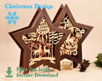 Peut inclure: Deux étoiles en bois avec des motifs découpés au laser. L'une représente une scène d'hiver avec des cerfs et des arbres, l'autre a un flocon de neige et un motif fantaisiste. Les deux ont une finition brune et sont éclairées par des guirlandes lumineuses. Le texte "Live Love Laugh" est visible sur le devant de l'étoile. Le texte "Files for Laser Instant Download" est également visible.