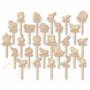 May include: A collection of wooden garden markers, each featuring a different vegetable or herb. The markers are light brown and include labels such as "Tomato," "Lettuce," and "Garlic." The design is simple and rustic, perfect for a home garden.