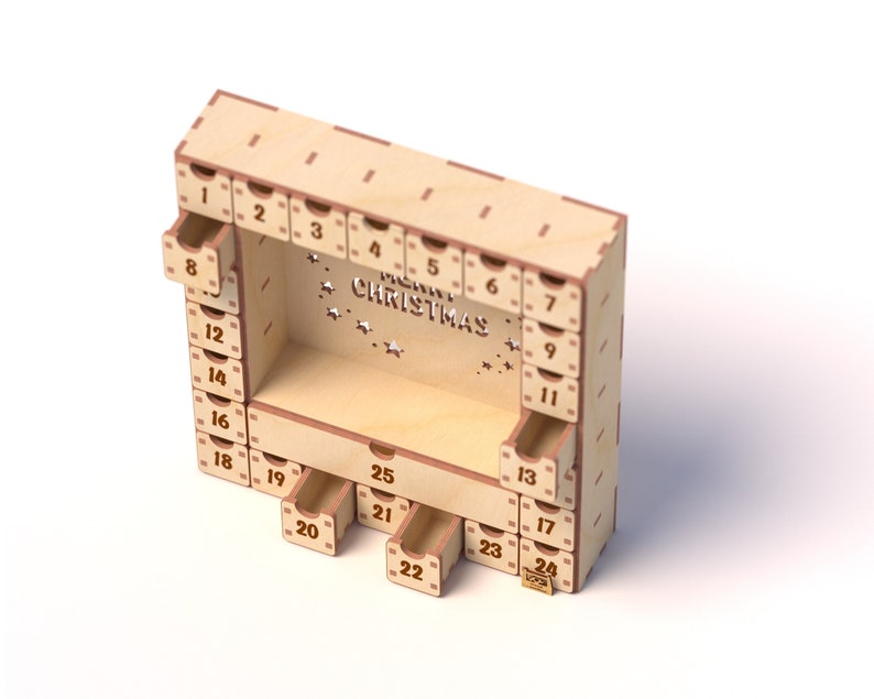 May include: A wooden advent calendar with 24 drawers, each with a number from 1 to 24. The calendar is decorated with the words "Merry Christmas" and stars.