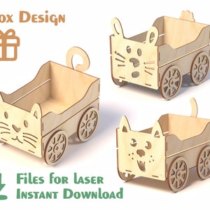 May include: Three wooden cat-shaped boxes with wheels. Each box features a different cat face design. The boxes are made from light brown wood and have a natural finish. The boxes are designed for laser cutting.