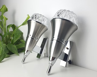Set of 2 Brutalist Space Age sconces on silver metal and chrome with clear glass