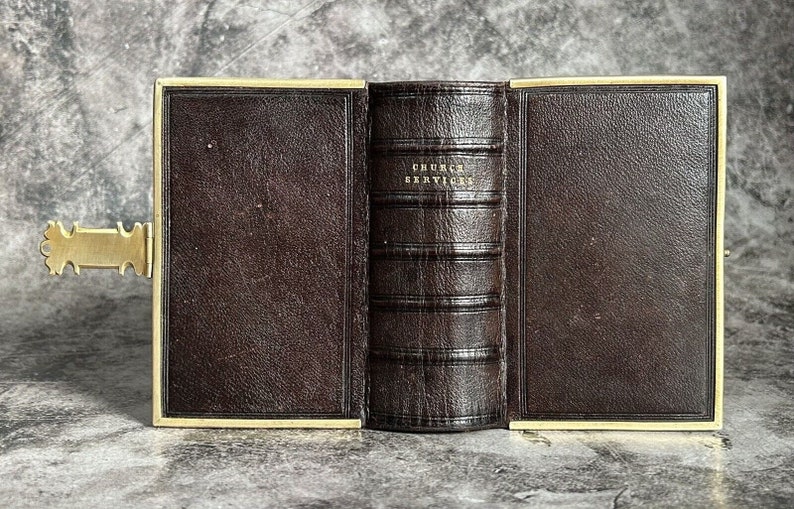 May include: A brown leather-bound book with gold accents and the title "CHURCH SERVICES" embossed on the spine.
