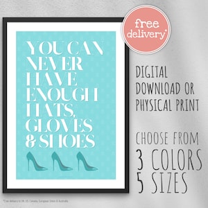 May include: A turquoise blue printable poster with the text "You can never have enough hats, gloves & shoes" and three pairs of high heels in white. The poster is framed in black.