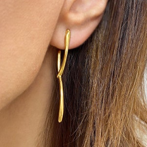 Asymmetrical studs!

Are you looking for Long gold studs?

You will love these Stacking earrings that are so dainty.
2 gold lines shape these minimal asymmetrical studs.
If you are fun of minimalist earrings, these Floating earrings are a great idea.