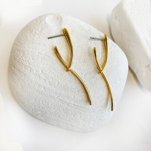 Asymmetrical studs!

Are you looking for Long gold studs?

You will love these Stacking earrings that are so dainty.
2 gold lines shape these minimal asymmetrical studs.
If you are fun of minimalist earrings, these Floating earrings are a great idea.