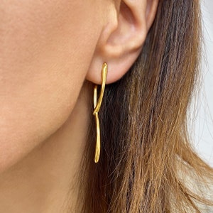 Asymmetrical studs!

Are you looking for Long gold studs?

You will love these Stacking earrings that are so dainty.
2 gold lines shape these minimal asymmetrical studs.
If you are fun of minimalist earrings, these Floating earrings are a great idea.