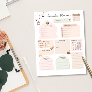 May include: A printable Ramadan planner with sections for daily goals, meal prep, hydration tracking, and reflection. The planner features a mosque, crescent moon, and other Islamic symbols.