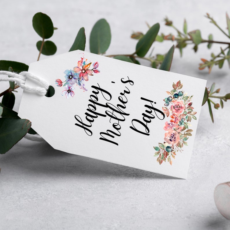 May include: White gift tag with a floral design and the text "Happy Mother's Day!" in black calligraphy.