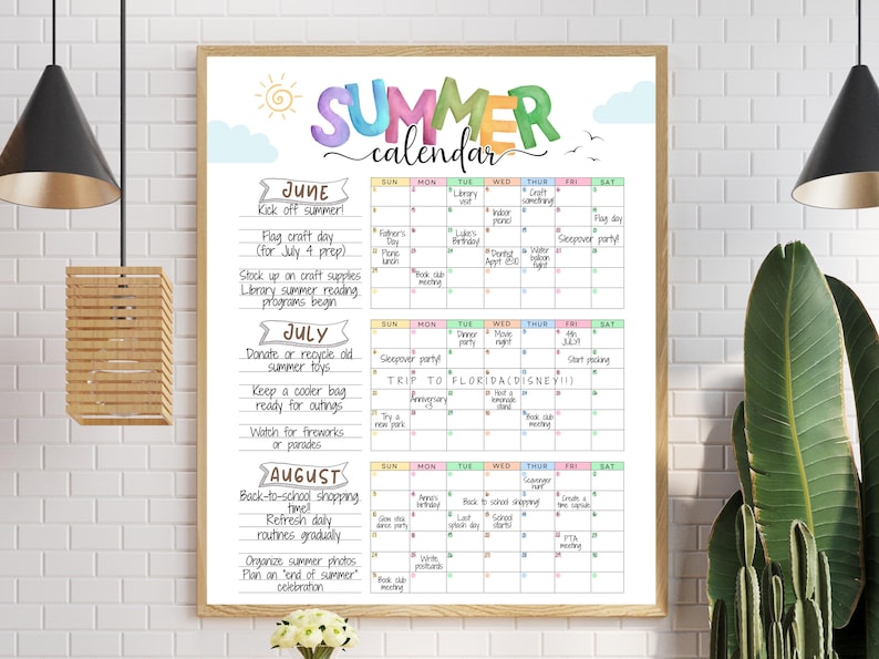 May include: A framed summer calendar with a wooden frame. The calendar is filled with colorful text and illustrations, including the word "SUMMER" in large, multi-colored letters. The calendar includes dates for June, July, and August, with various summer activities.