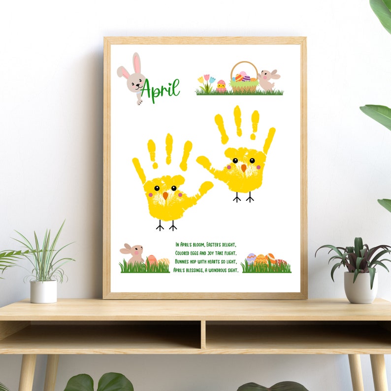 May include: A framed print with a yellow chick handprint art project. The print has the word 'April' at the top and a poem about Easter. The poem reads: 'In April's bloom, Easter's delight, Colored eggs and joy take flight. Bunnies hop with hearts so light, April's blessings, a wondrous sight.'