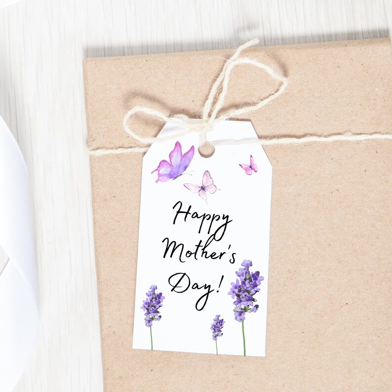 May include: White gift tag with the text "Happy Mother's Day!" in black cursive script. The tag is decorated with purple lavender flowers and pink butterflies.