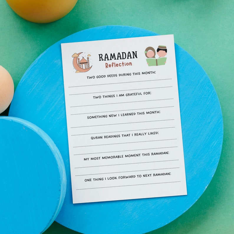 May include: A printable Ramadan reflection worksheet featuring a cartoon illustration of a mosque and two people reading a book. The worksheet includes prompts for reflecting on good deeds, gratitude, new learnings, Quran readings, memorable moments, and things to look forward to in the next Ramadan.