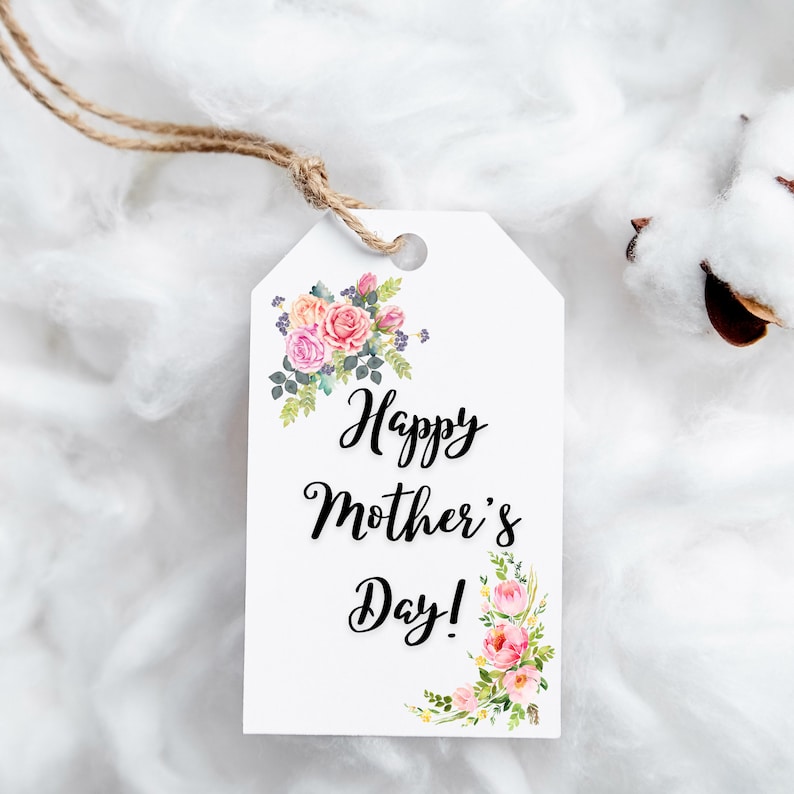 May include: White gift tag with the text "Happy Mother's Day!" in black script font. The tag is decorated with pink and white watercolor flowers.