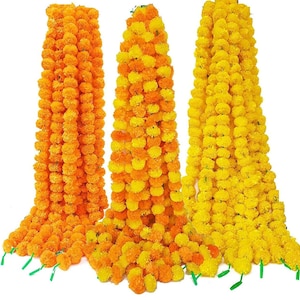May include: Three strands of marigold flower garlands, one yellow, one orange, and one with alternating yellow and orange flowers.