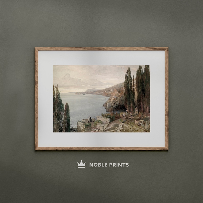 May include: A framed painting depicting a coastal scene with a view of a town and a body of water. The painting features a light blue sky with white clouds, a dark blue body of water, and a town with white buildings. The painting is framed in a light brown wooden frame.