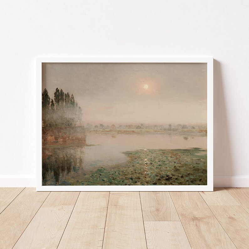 May include: A painting of a misty lake scene with a single sun shining through the clouds. The lake is covered in lily pads and the trees on the shore are reflected in the water.
