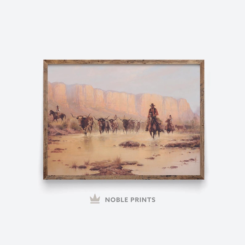 May include: A painting of a group of cowboys riding horses through a shallow river, driving a herd of longhorn cattle. The cowboys are wearing traditional western clothing and the cattle are brown and white. The background is a desert landscape with red rock cliffs.