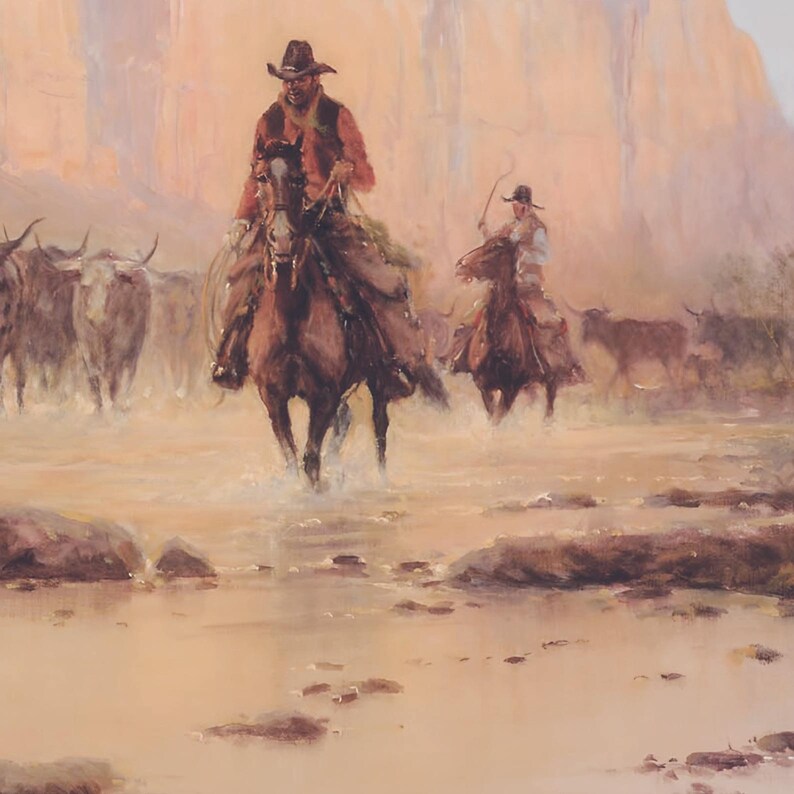 May include: Two cowboys on horseback lead a herd of cattle through a shallow river. The cowboys are wearing traditional western wear, including hats and bandanas. The cattle are brown and white, and the river is a light brown color.
