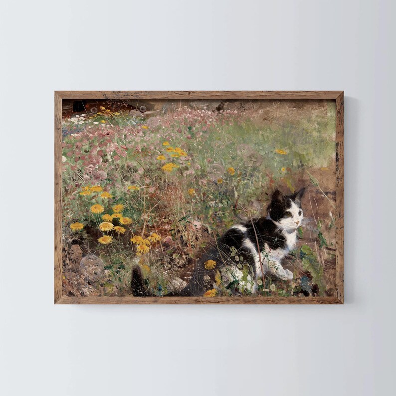 May include: A black and white cat sits in a field of yellow and pink flowers. The cat is looking to the right of the image. The background is a blurred field of green and brown.