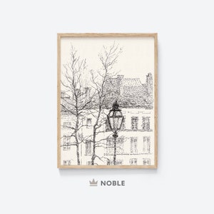 May include: Black and white line drawing of a street scene with a lamppost and buildings. The drawing is framed in a light wood frame.