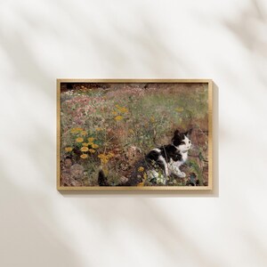May include: A black and white cat sits in a field of yellow and pink wildflowers. The cat is looking to the right of the image. The background is a blurry field of wildflowers.