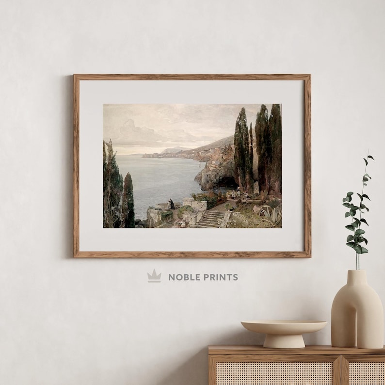 May include: A vintage painting depicting a coastal scene with a stone staircase leading down to a rocky shoreline. The painting features a blue sea, a cloudy sky, and lush green trees.