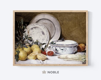 May include: A still life painting of a white porcelain tureen with a lid, surrounded by lemons, a sprig of green leaves, and three white ceramic plates. The tureen has a blue and white floral design. The painting is framed in a light brown wood frame.