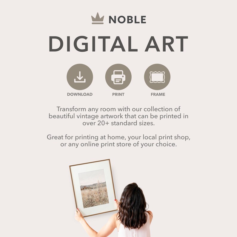 May include: Digital art print download. A woman holds a framed print of a vintage landscape scene. The print is available in over 20 sizes.