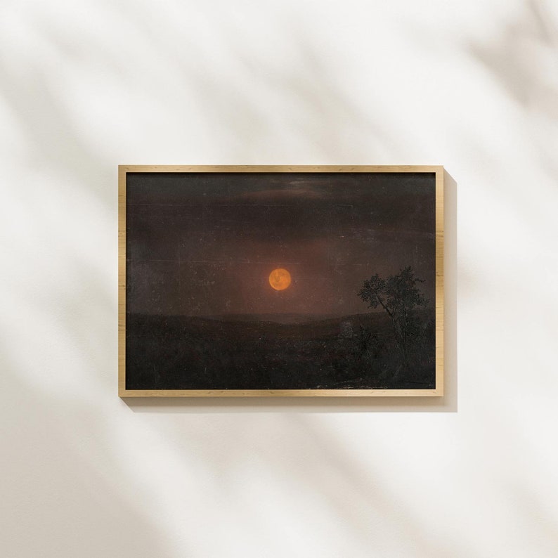 May include: A framed painting of a dark landscape with a large, orange moon in the sky. A single tree stands silhouetted against the moon.