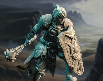 May include: A detailed figurine of a warrior in full armor, holding a mace and shield. The shield features a heraldic design. The figure is standing on a rock, with a mountainous landscape in the background. The armor has intricate details.