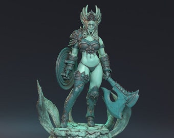 May include: A teal-colored figurine of a female warrior, holding an axe and shield. She wears detailed armor, a crown, and stands on a decorative base. The figure has long hair and is posed in a dynamic stance, ready for battle.