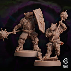 May include: Two miniature figurines of rat-like creatures wearing armor and wielding weapons. One figure holds a shield and a mace, while the other holds a spiked club. Both figures are painted in a brown and grey color scheme.