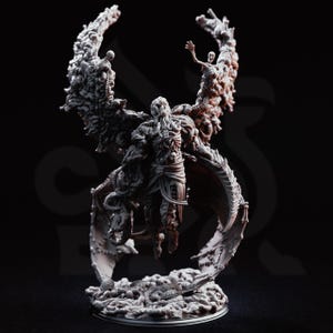 May include: A light gray resin figurine of a winged humanoid creature with a skeletal torso and tentacles. The figure features large, intricate wings composed of numerous small skulls and bones, standing atop a base covered in skeletal remains.