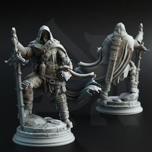 May include: A detailed miniature figurine of a warrior in a hooded cloak, holding a sword and standing on a stone base. The figurine is painted in a gray color and has a realistic appearance.
