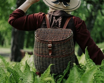 Modern hand woven basket backpack with durable leather straps for summer harvest