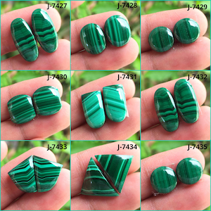 May include: A collection of polished malachite gemstones in various shapes, including oval, round, and rectangular. The stones display a vibrant green color with distinctive banded patterns. Each pair is labeled with a unique "J" number.