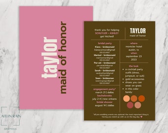 May include: A brown card with a pink card on top. The brown card has the text "TAYLOR maid of honor" and lists the details for a wedding. The pink card has the text "taylor maid of honor".