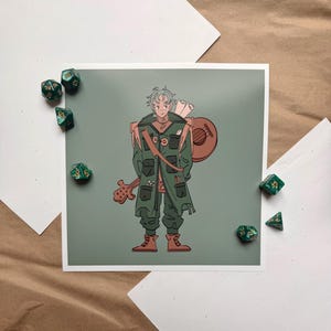 May include: An illustration of a character in green clothing with a lute and a scroll. The character is standing in front of a green background. Several green and gold dice are scattered around the print.
