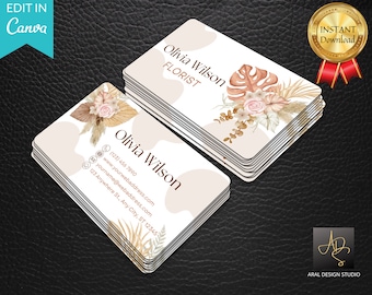 May include: A stack of business cards with a floral design and the text "Olivia Wilson FLORIST" on the top card. The bottom card has the text "Olivia Wilson" and contact information including a phone number, website address, email address, and physical address.