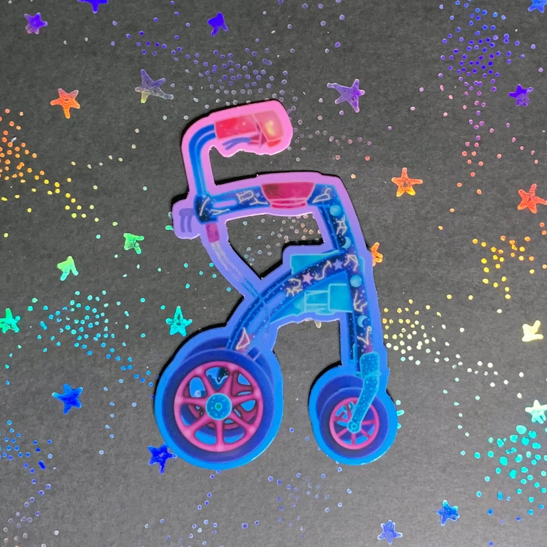 A die-cut sticker of a wheeled, rolling walker in shades of purple, pink, and blue. The walker is decorated with stars, constellations, and moon phases.