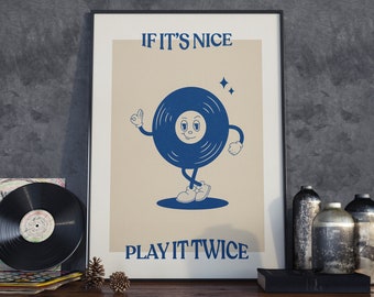 May include: A framed print with a vintage aesthetic featuring a cartoon vinyl record with a smiling face. The text on the print reads "If it's nice play it twice."